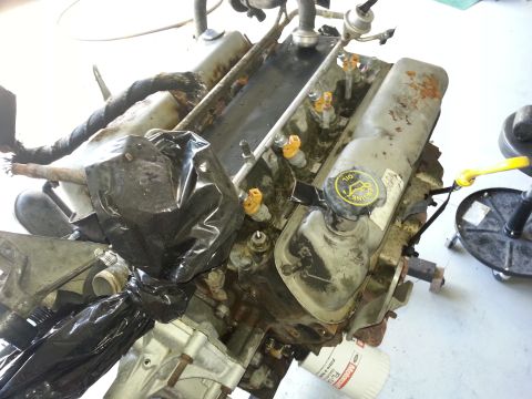1994 Ford Bronco - This V8 engine appears to be undergoing some form of maintenance or repair, with parts covered in plastic.