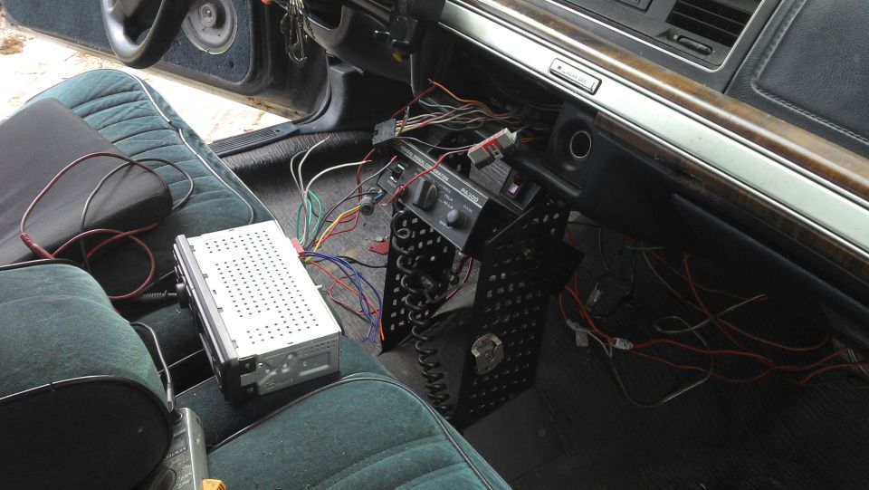 1991 Ford Crown Victoria interior showing dashboard wiring and aftermarket radio installation