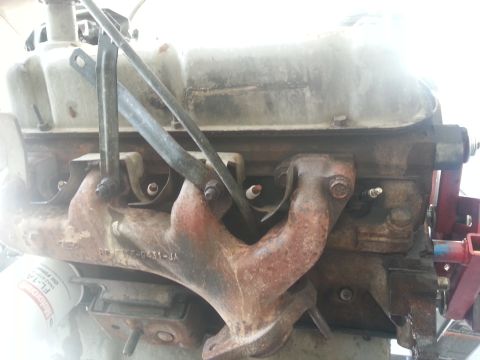 1994 Ford Bronco - Close-up of an engine part, likely from a Ford vehicle, with visible part numbers and an oil filter.
