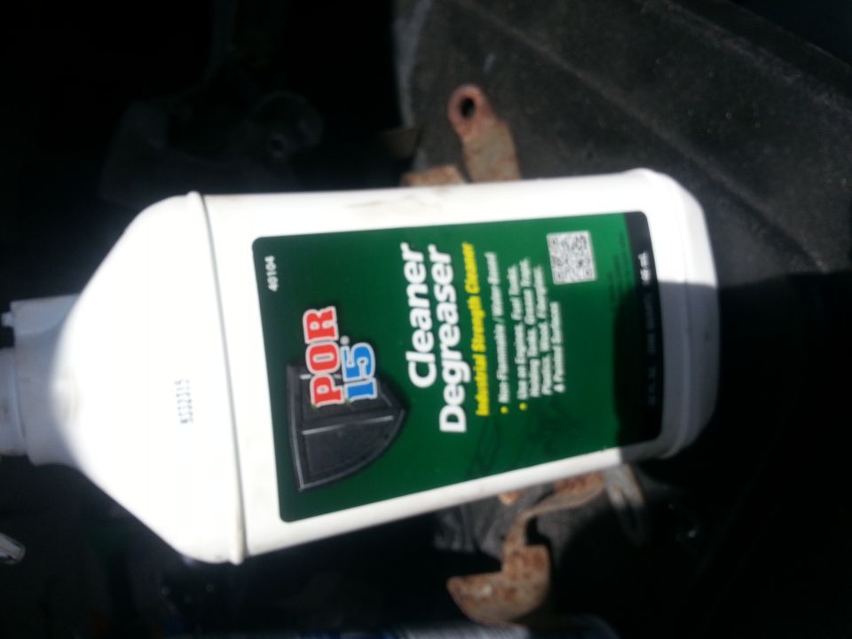 Bottle of POR-15 Cleaner Degreaser, industrial strength, in a dark area