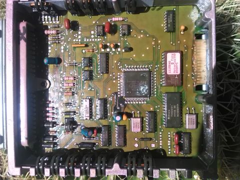 1992 Ford Bronco - This is an engine control unit, showing its internal electronic components and circuitry.
