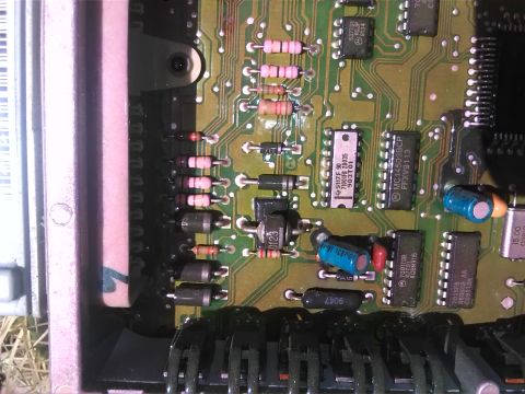 1992 Ford Bronco - A detailed view of an electronic circuit board, likely an engine control unit, with various components.