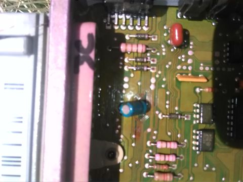 1992 Ford Bronco - A detailed view of an electronic circuit board, various components like resistors and capacitors. The text 'GX' is visible on a pink compon…