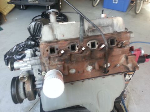 1994 Ford Bronco - Engine block with oil filter and pulley system, showing rust and wear.