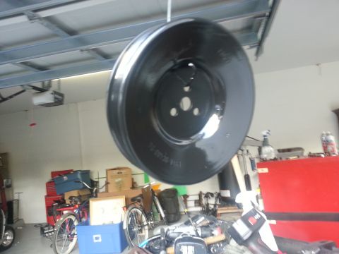 1994 Ford Bronco - Pulley hanging in a garage, with bikes and storage boxes in the background.