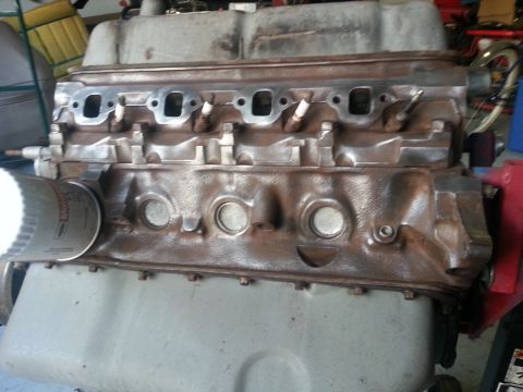 1994 Ford Bronco - Engine block with oil filter, exhaust ports, and spark plug holes visible.