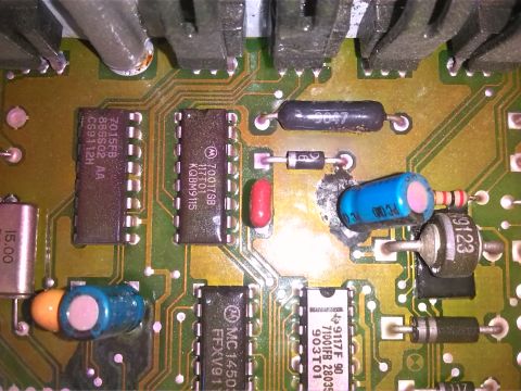1992 Ford Bronco - Close-up view of a complex electronic circuit board with various electronic components and visible text.