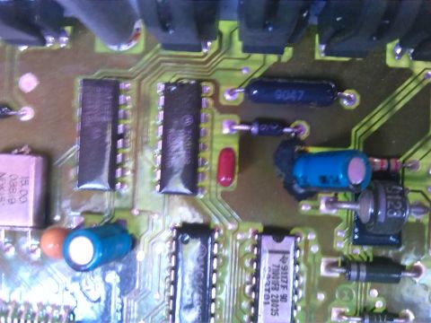 1992 Ford Bronco - A detailed view of a complex electronic circuit board, various chips, resistors, and capacitors.