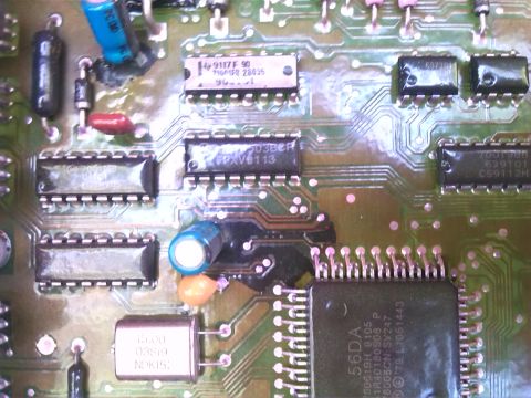 1992 Ford Bronco - A detailed view of electronic components and circuitry on a green printed circuit board.