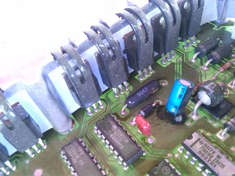 1992 Ford Bronco - A detailed view of an electronic circuit board, transistors, capacitors, and integrated circuits.