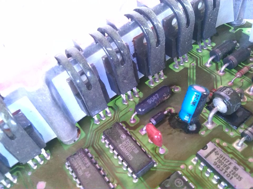 Close-up of electronic circuit board with transistors and capacitors
