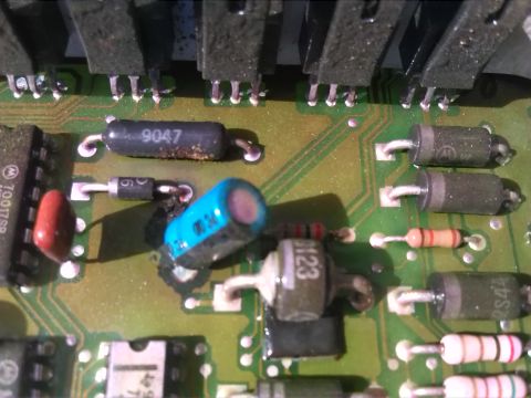 1992 Ford Bronco - A detailed view of electronic components on a circuit board, with some parts showing signs of age and use.