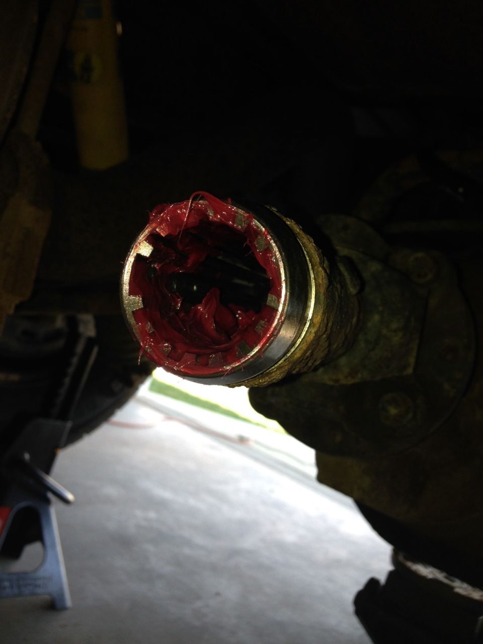 Decided to grease up my rear drive shaft to get rid of the stop and go "clunk" and noticed this. Might need to replace. :(
