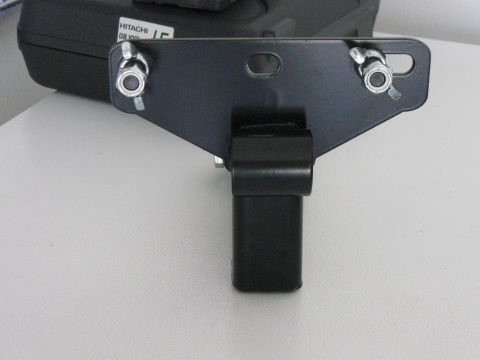 1999 Ford Ranger - A close-up view of a black metal hitch receiver part, with visible bolts and nuts, against a neutral background.