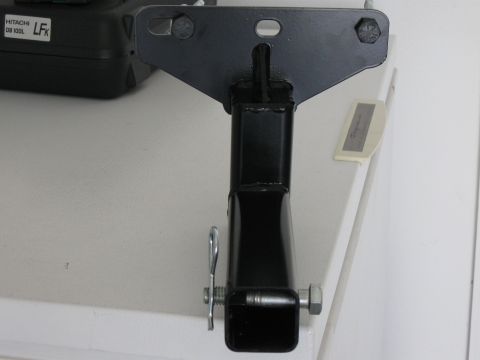 1999 Ford Ranger - Close-up of a black metal hitch receiver part, showing the pin and bolt mechanism.