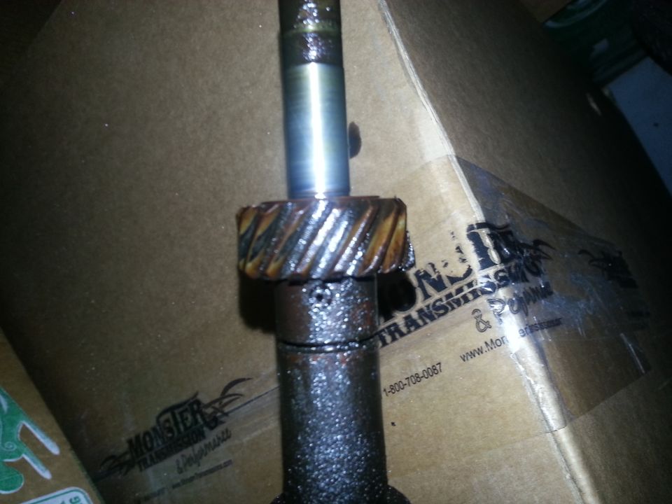 Close-up of a metal shaft with a gear, part of a transmission
