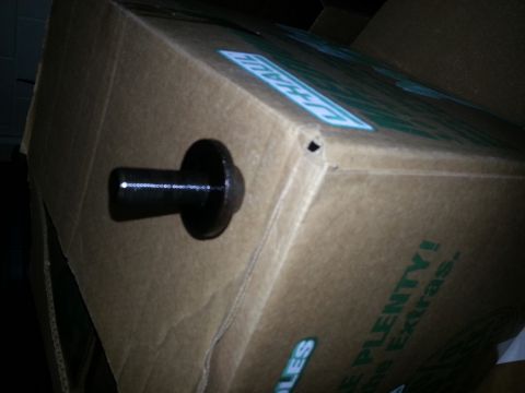 1994 Ford Bronco - A black bolt is seen protruding from a U-Haul branded cardboard box.