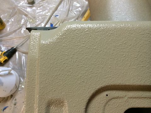 1996 Ford Bronco - Close-up of a textured surface, likely a vehicle part, with tools nearby. Supermotors.net logo is present.