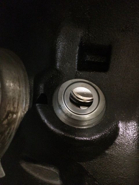 1996 Ford Bronco - This is a close-up view of a vehicle's differential housing, showing a bearing race within a machined opening.