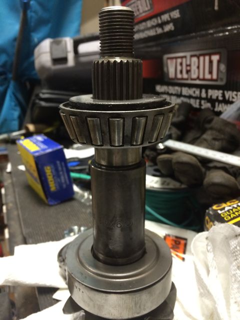 1996 Ford Bronco - Close-up of a tapered roller bearing and gear shaft assembly, with a MOOG box visible.