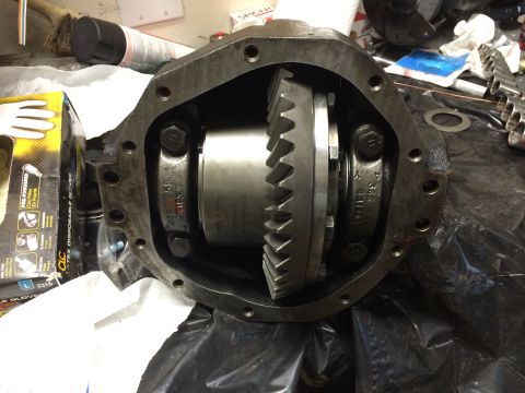 1996 Ford Bronco - Close-up view of a differential housing, revealing the ring gear and pinion assembly, with visible part numbers stamped on the components.