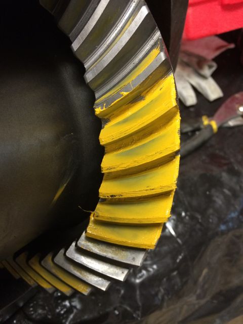 1996 Ford Bronco - Close-up of a differential ring gear showing yellow paint applied to the teeth.