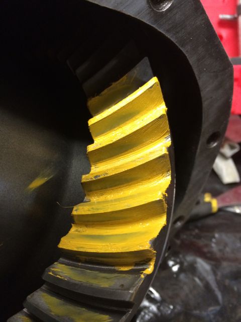 1996 Ford Bronco - Close-up of a differential gear showing yellow marking compound applied to the teeth.