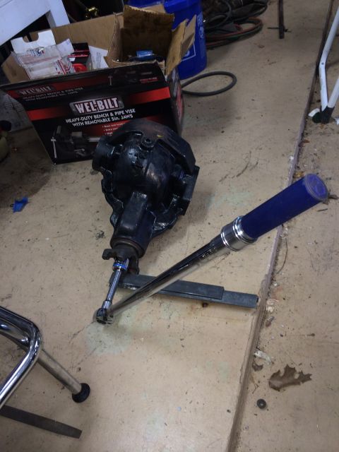1996 Ford Bronco - A vehicle part is shown lying on the floor indoors.