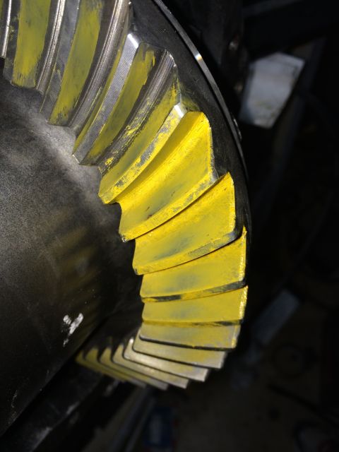 1996 Ford Bronco - Close-up of a differential gear with yellow paint on its teeth.