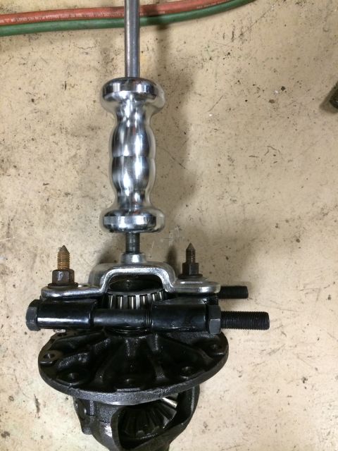 1996 Ford Bronco - A slide hammer is used with a bearing puller to remove a component from a vehicle differential.