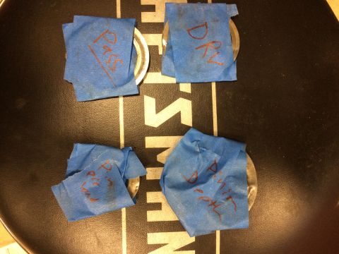 1996 Ford Bronco - Four automotive parts are covered in blue tape with handwritten labels.