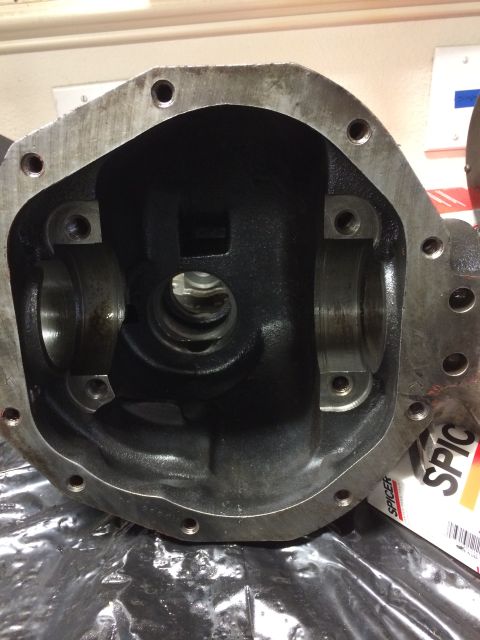 1996 Ford Bronco - A differential housing, possibly for a Ford vehicle, is shown with visible Spicer branding on packaging in the background.