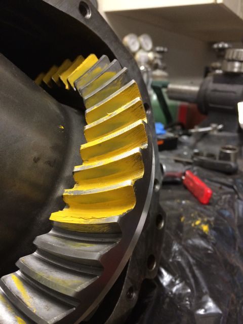 1996 Ford Bronco - A close-up view of a differential gear set, showing the teeth with yellow paint markings.