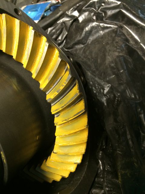 1996 Ford Bronco - Close-up of a differential gear with yellow paint applied to the teeth, likely for wear pattern analysis.