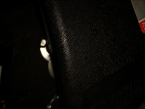 1996 Ford Bronco - Close-up of a dark, textured interior panel with a visible latch.