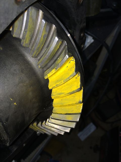 1996 Ford Bronco - Close-up of a differential gear showing yellow paint applied to the teeth for analysis.