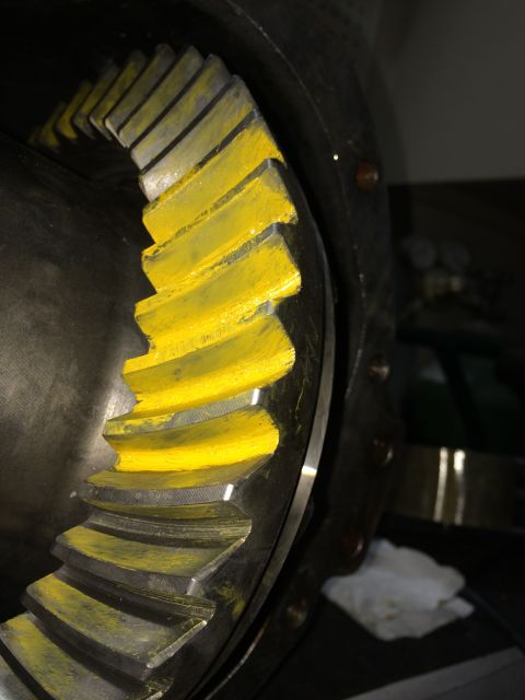 1996 Ford Bronco - Close-up of a differential gear with yellow markings on the teeth, indicating a specific part or setting.