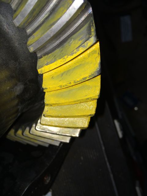 1996 Ford Bronco - Close-up of a differential gear showing yellow markings on the teeth.