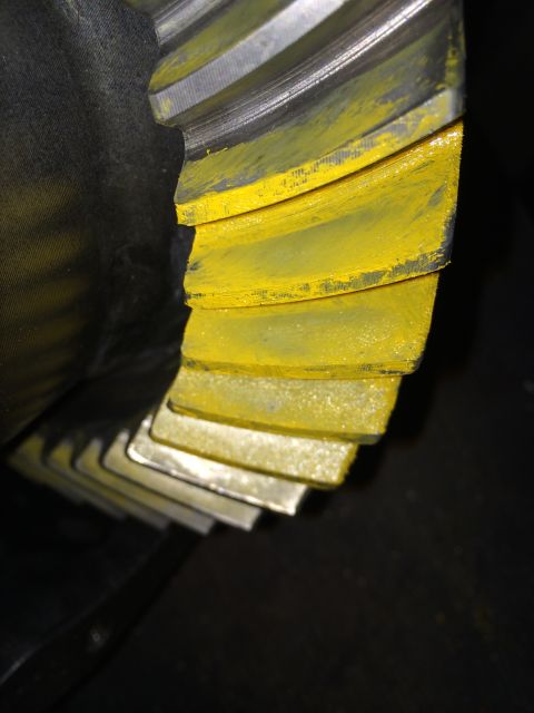 1996 Ford Bronco - Differential gear teeth showing contact pattern with yellow marking compound.