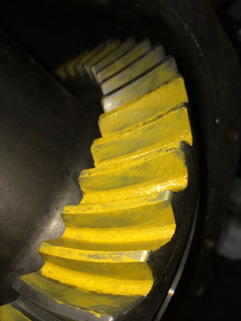 1996 Ford Bronco - Close-up of a differential gear with yellow paint on its teeth.