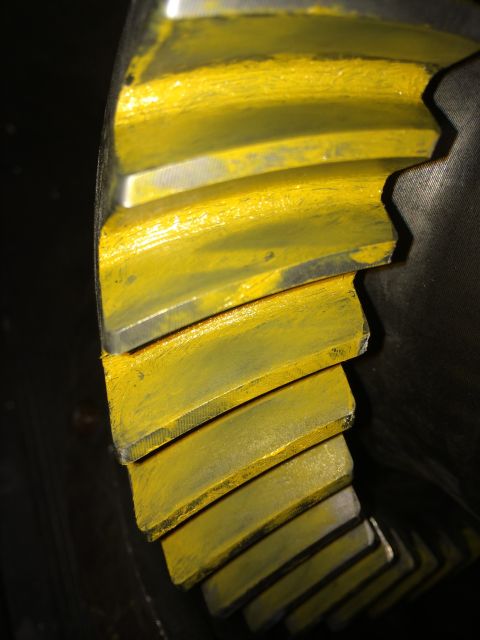 1996 Ford Bronco - This differential gear shows wear patterns on its teeth, indicated by the yellow coating.