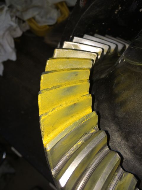 1996 Ford Bronco - Close-up of a differential gear showing yellow markings on its teeth.