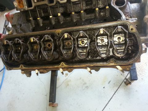 1994 Ford Bronco - Close-up view of an engine's internal components, including rocker arms and spark plugs.