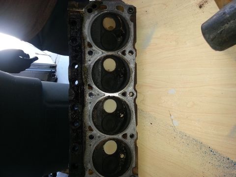 1994 Ford Bronco - A close-up view of an engine cylinder head, showing the internal structure of the cylinders.