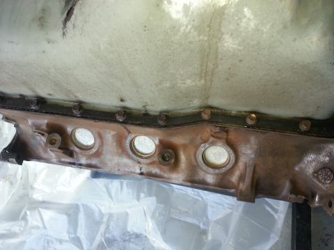 1994 Ford Bronco - Close-up view of an engine oil pan, showing its construction and bolt pattern.