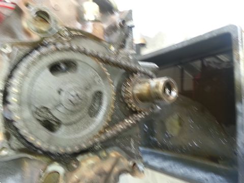 1994 Ford Bronco - This is a close-up view of an engine's timing chain and gears, showing mechanical components.