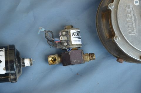 1979 Ford Bronco - Close-up of a propane solenoid and filter, likely for an automotive application.