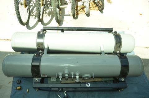 1979 Ford Bronco - Two large propane tanks are mounted on a rack, with bicycles visible overhead.