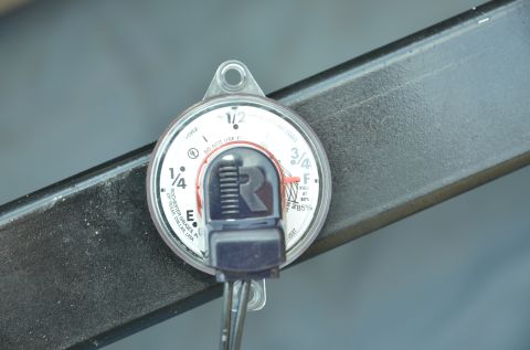 1979 Ford Bronco - Rochester fuel gauge shows the fuel level with markings for empty, quarter, half, three-quarters, and full.