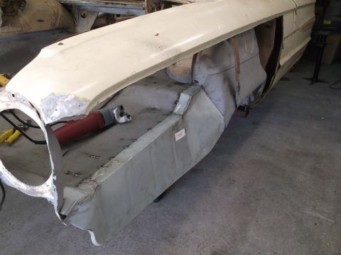 1964 Ford Galaxie - Body repair in progress on a 1964 Ford Galaxie, focusing on the fender and wheel well area.